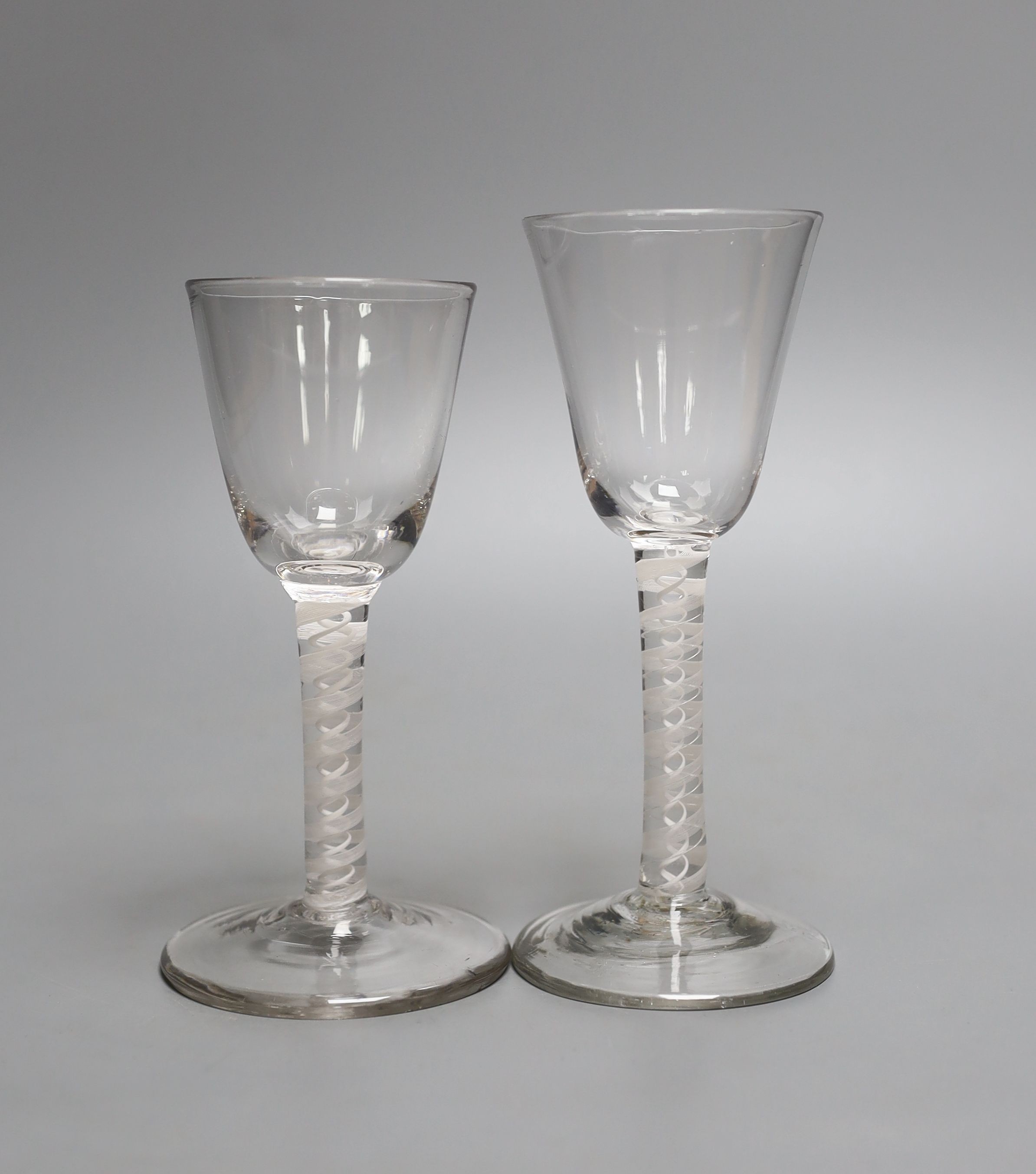 Two Georgian opaque twist cordials, tallest 16cm